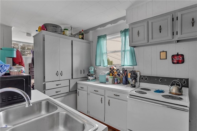 1505 Raymond Ave, Latrobe, PA 15650 - kitchen with white range with electric cooktop and light countertops