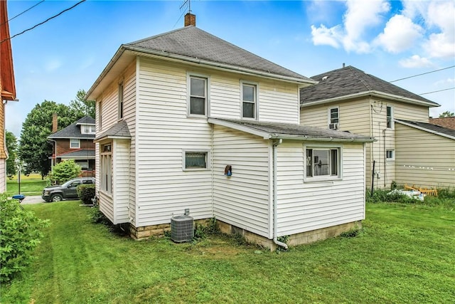 385 Spruce Ave, Sharon, PA 16146 - rear view of property featuring a lawn, a chimney, and a shingled roof