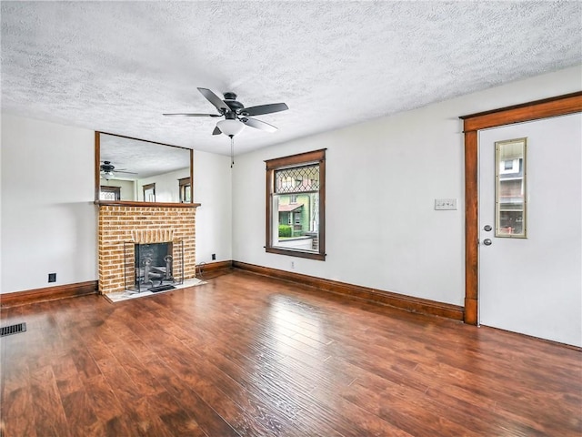 385 Spruce Ave, Sharon, PA 16146 - unfurnished living room with wood finished floors, ceiling fan, a textured ceiling, and a fireplace