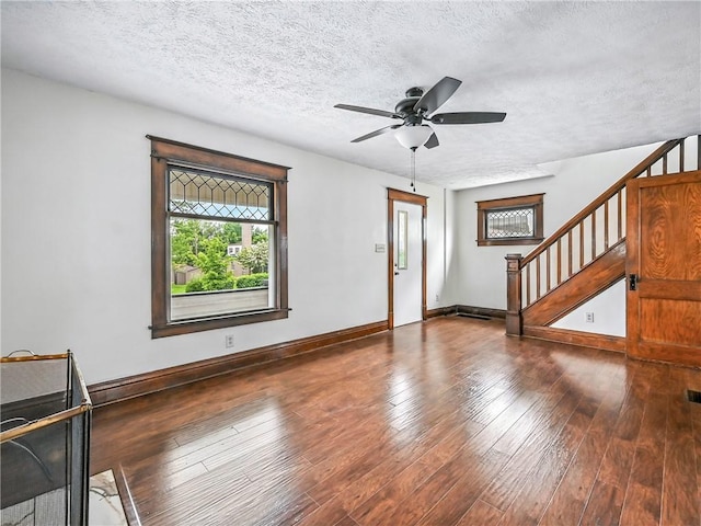 385 Spruce Ave, Sharon, PA 16146 - unfurnished living room with ceiling fan, stairs, a textured ceiling, and wood finished floors
