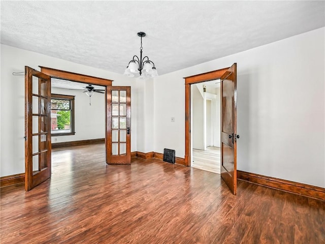 385 Spruce Ave, Sharon, PA 16146 - spare room featuring french doors, wood finished floors, and a chandelier