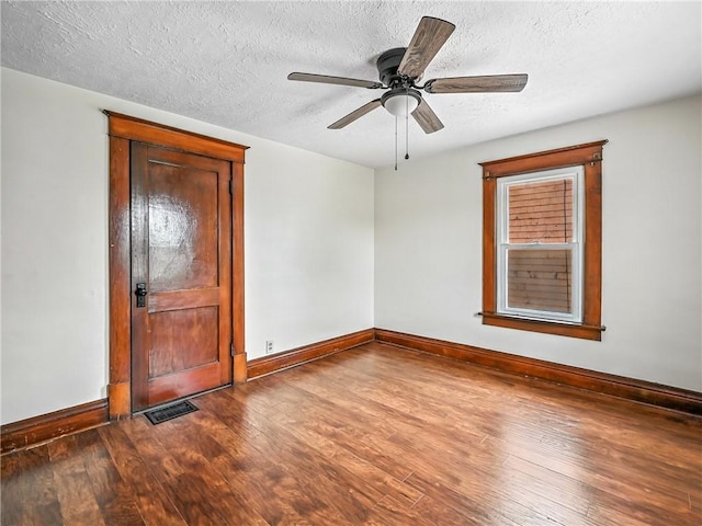 385 Spruce Ave, Sharon, PA 16146 - unfurnished room with wood finished floors, a textured ceiling, and a ceiling fan