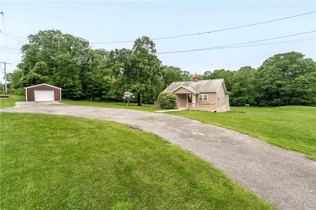 2228 Dinnerbell Five Forks Rd, Wharton Twp, PA 15437 - view of front of property with an outdoor structure, a detached garage, a front lawn, and driveway