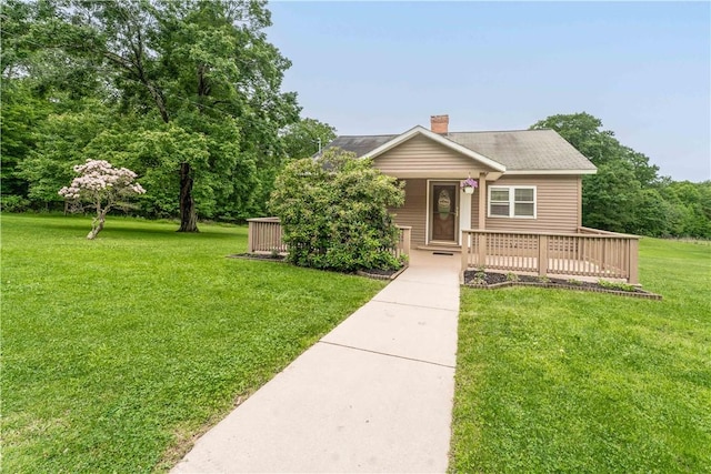 2228 Dinnerbell Five Forks Rd, Wharton Twp, PA 15437 - view of front of property featuring a front lawn, a chimney, and a porch