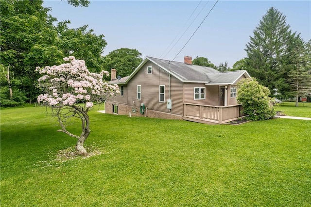 2228 Dinnerbell Five Forks Rd, Wharton Twp, PA 15437 - view of home's exterior with a chimney, a wooden deck, and a yard