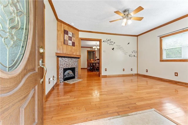 2228 Dinnerbell Five Forks Rd, Wharton Twp, PA 15437 - unfurnished living room featuring light wood finished floors, ornamental molding, a ceiling fan, a chandelier, and a tiled fireplace