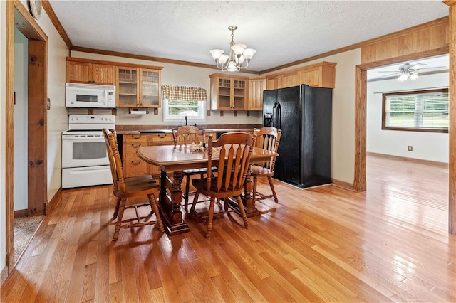 2228 Dinnerbell Five Forks Rd, Wharton Twp, PA 15437 - kitchen with white appliances, crown molding, a chandelier, light wood-type flooring, and glass insert cabinets