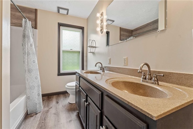 2228 Dinnerbell Five Forks Rd, Wharton Twp, PA 15437 - full bath with double vanity, wood finished floors, and shower / bath combo