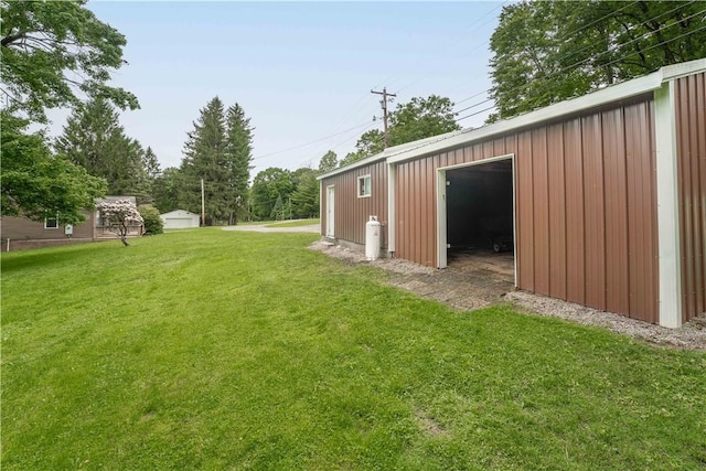 2228 Dinnerbell Five Forks Rd, Wharton Twp, PA 15437 - view of green lawn with an outbuilding and a detached garage