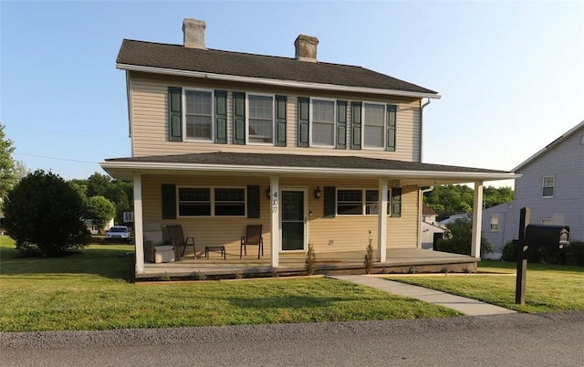 407 1st St, South Union Twp, PA 15401 - view of front of property with covered porch, a front yard, and a chimney