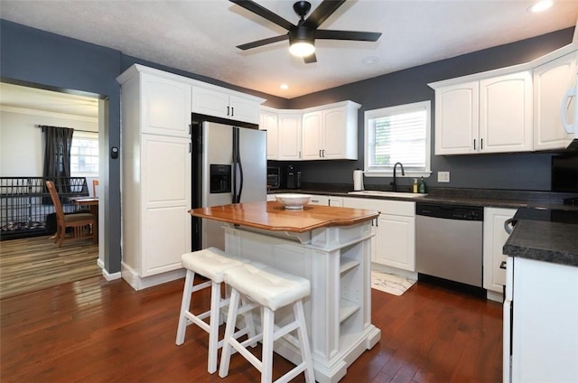 407 1st St, South Union Twp, PA 15401 - kitchen with appliances with stainless steel finishes, ceiling fan, recessed lighting, white cabinets, and dark wood-style flooring