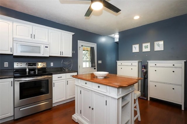 407 1st St, South Union Twp, PA 15401 - kitchen featuring white microwave, electric stove, wood counters, dark wood-style flooring, and recessed lighting