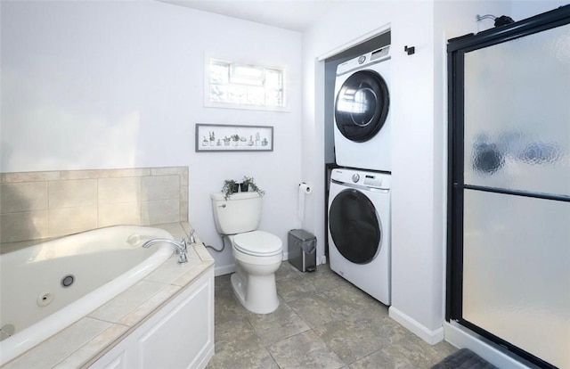 407 1st St, South Union Twp, PA 15401 - full bathroom featuring stacked washer / dryer, a shower stall, and a whirlpool tub
