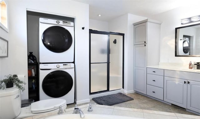 407 1st St, South Union Twp, PA 15401 - bathroom with stacked washer / dryer, a stall shower, vanity, a bathtub, and recessed lighting