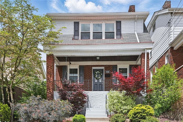 3236 Beacon Hill Ave, Dormont, PA 15216 - american foursquare style home featuring a porch, a chimney, and brick siding