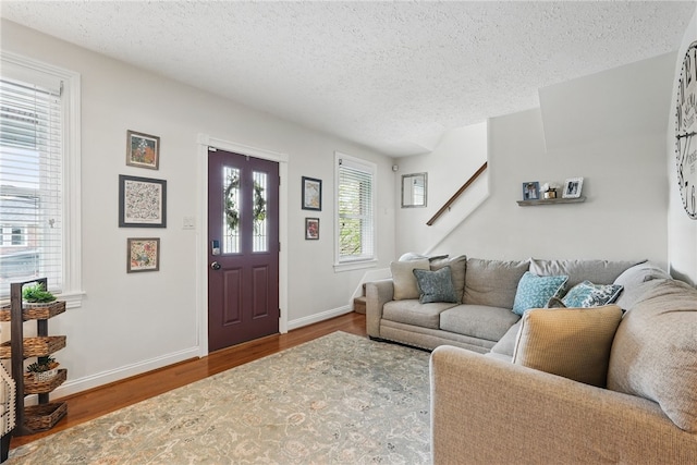 3236 Beacon Hill Ave, Dormont, PA 15216 - living area featuring a textured ceiling and wood finished floors