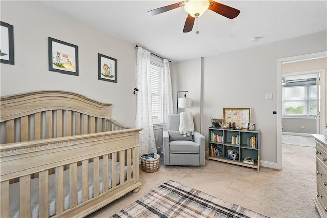 3236 Beacon Hill Ave, Dormont, PA 15216 - bedroom with carpet, a crib, a ceiling fan, and a textured ceiling