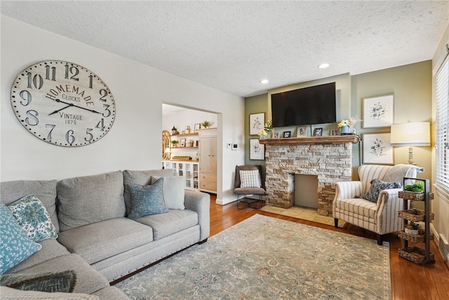 3236 Beacon Hill Ave, Dormont, PA 15216 - living room with a textured ceiling, wood finished floors, and recessed lighting