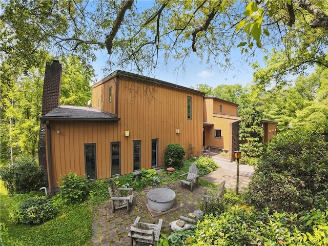 117 Scarborough Ln, Peters Twp, PA 15317 - rear view of property featuring a chimney and a patio area