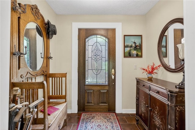 117 Scarborough Ln, Peters Twp, PA 15317 - foyer entrance featuring dark tile patterned flooring and a textured ceiling