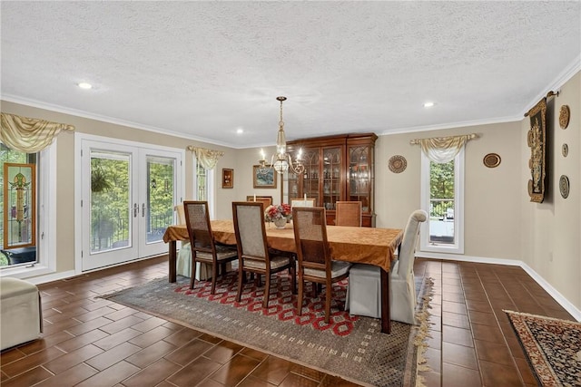 117 Scarborough Ln, Peters Twp, PA 15317 - dining area with crown molding, a textured ceiling, a chandelier, recessed lighting, and french doors