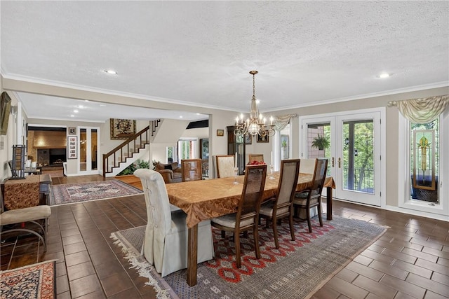 117 Scarborough Ln, Peters Twp, PA 15317 - dining room featuring stairs, a chandelier, recessed lighting, ornamental molding, and french doors