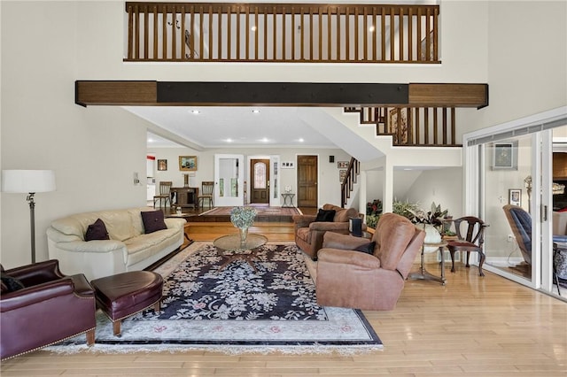 117 Scarborough Ln, Peters Twp, PA 15317 - living area with stairs, wood finished floors, a high ceiling, and recessed lighting