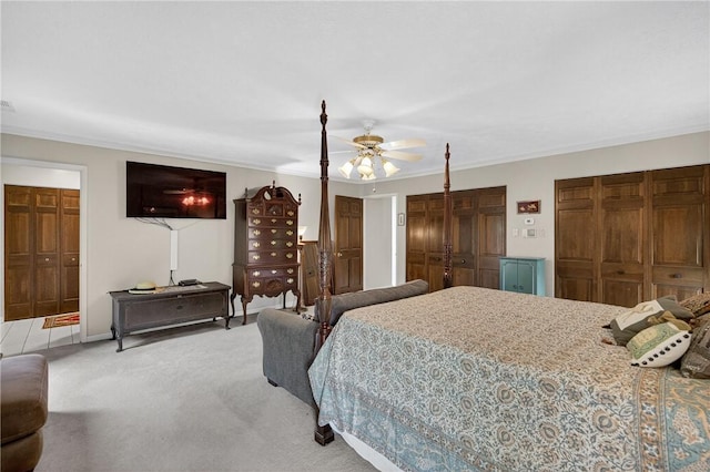 117 Scarborough Ln, Peters Twp, PA 15317 - bedroom with light carpet, ornamental molding, ceiling fan, and two closets