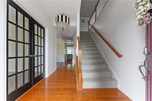 4015 Bentwood Dr, North Strabane, PA 15317 - stairs with wood finished floors and french doors