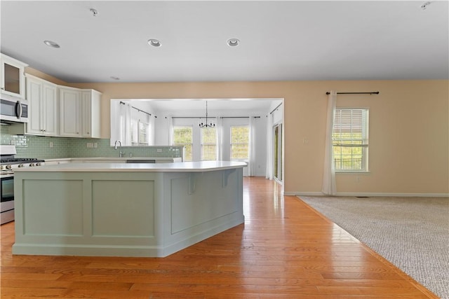 4015 Bentwood Dr, North Strabane, PA 15317 - kitchen featuring stainless steel appliances, light countertops, light wood-type flooring, healthy amount of natural light, and recessed lighting