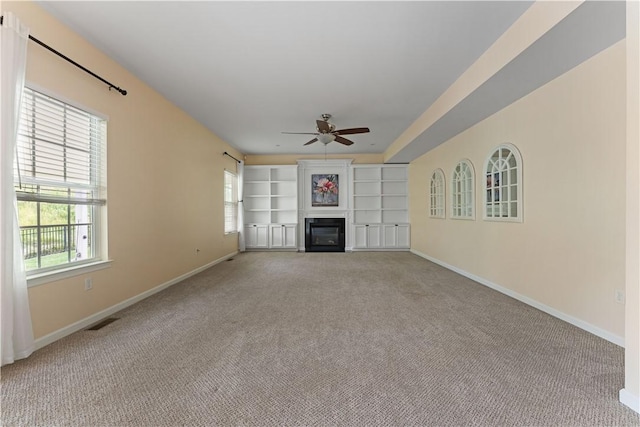 4015 Bentwood Dr, North Strabane, PA 15317 - unfurnished living room with a ceiling fan, carpet flooring, and a glass covered fireplace