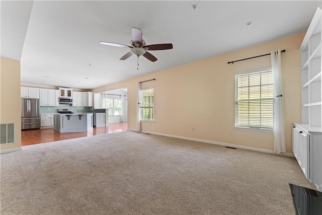 4015 Bentwood Dr, North Strabane, PA 15317 - unfurnished living room with light carpet and a ceiling fan