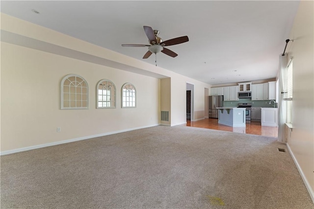 4015 Bentwood Dr, North Strabane, PA 15317 - unfurnished living room with light colored carpet and ceiling fan