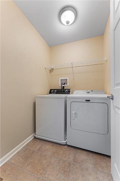 4015 Bentwood Dr, North Strabane, PA 15317 - laundry area featuring washing machine and clothes dryer and light tile patterned floors