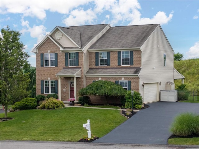 4015 Bentwood Dr, North Strabane, PA 15317 - view of front of home with asphalt driveway, a garage, brick siding, and roof with shingles