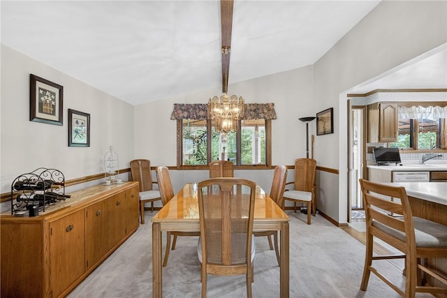 12169 Pine Crest Ct, North Huntingdon, PA 15085 - dining room featuring lofted ceiling, light colored carpet, and a chandelier