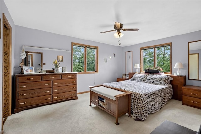12169 Pine Crest Ct, North Huntingdon, PA 15085 - bedroom featuring light carpet, multiple windows, and ceiling fan