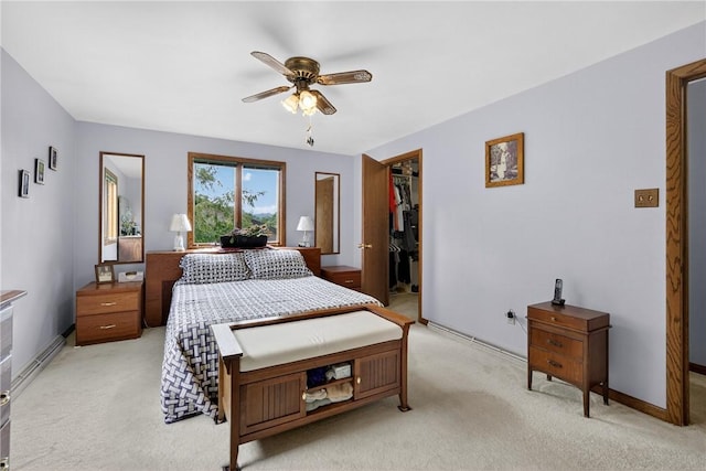 12169 Pine Crest Ct, North Huntingdon, PA 15085 - bedroom featuring light carpet, a walk in closet, a closet, and ceiling fan