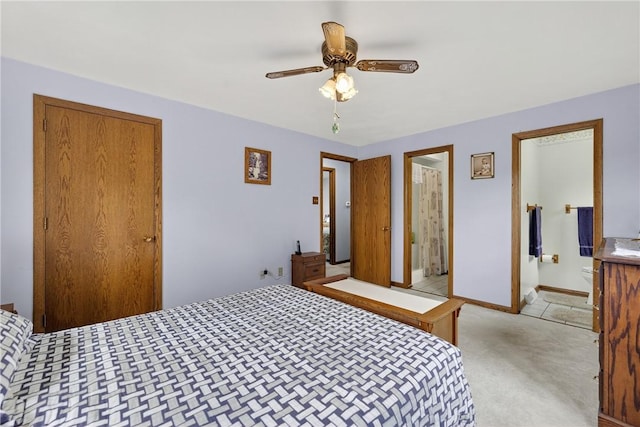 12169 Pine Crest Ct, North Huntingdon, PA 15085 - bedroom with light carpet, ceiling fan, and ensuite bathroom