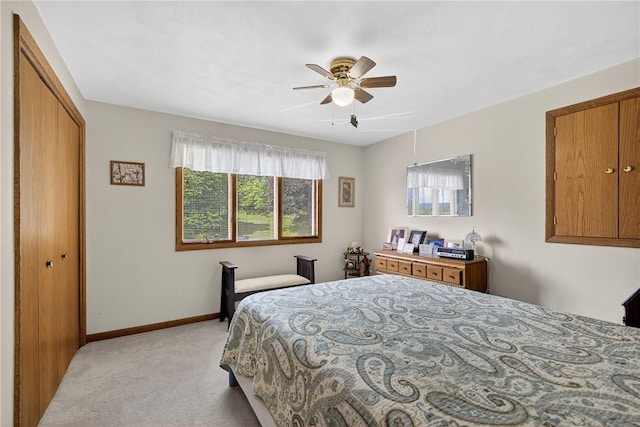 12169 Pine Crest Ct, North Huntingdon, PA 15085 - bedroom with light colored carpet, a closet, and ceiling fan