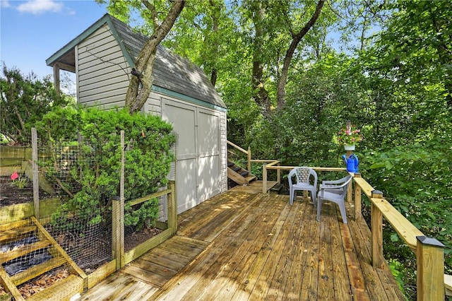 12169 Pine Crest Ct, North Huntingdon, PA 15085 - wooden terrace with a storage shed and view of wooded area