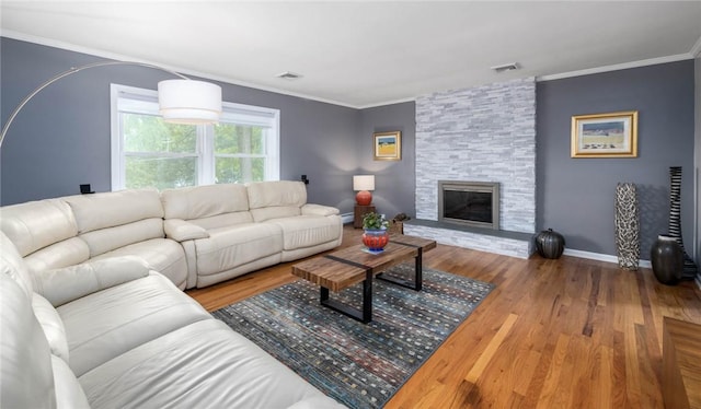 537 Center Church Rd, Peters Twp, PA 15317 - living room with wood finished floors, ornamental molding, a stone fireplace, and baseboard heating