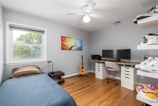 537 Center Church Rd, Peters Twp, PA 15317 - bedroom featuring light wood-style floors, a baseboard radiator, a desk, and a ceiling fan