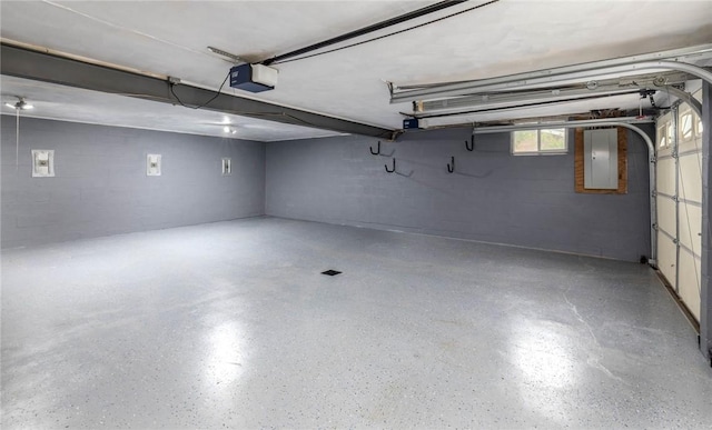 537 Center Church Rd, Peters Twp, PA 15317 - garage with a garage door opener, concrete block wall, and electric panel