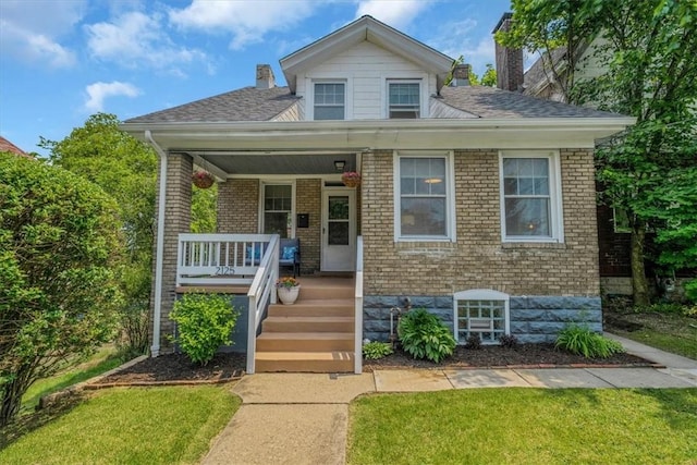 2125 Vodeli St, Beechview, PA 15216 - bungalow-style home featuring a chimney, a porch, and brick siding