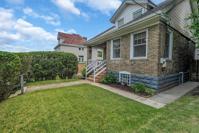 2125 Vodeli St, Beechview, PA 15216 - view of front of house with brick siding and a front yard