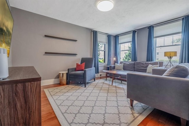 2125 Vodeli St, Beechview, PA 15216 - living area with wood finished floors and a textured ceiling
