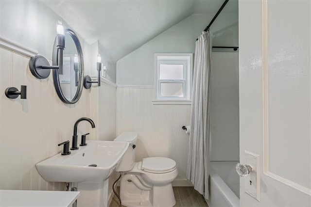 2125 Vodeli St, Beechview, PA 15216 - full bathroom with lofted ceiling, shower / bath combination with curtain, and wainscoting