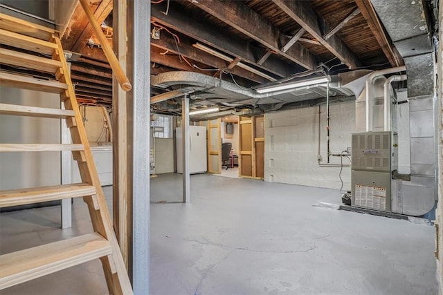 2125 Vodeli St, Beechview, PA 15216 - unfinished basement with freestanding refrigerator, washer / clothes dryer, and heating unit