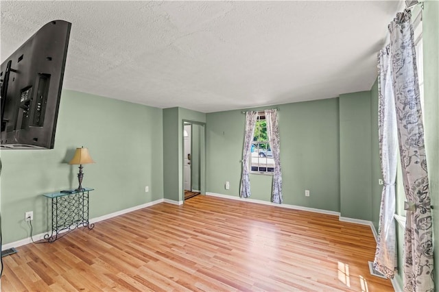 25 Iron St, Canonsburg, PA 15317 - empty room featuring wood finished floors and a textured ceiling